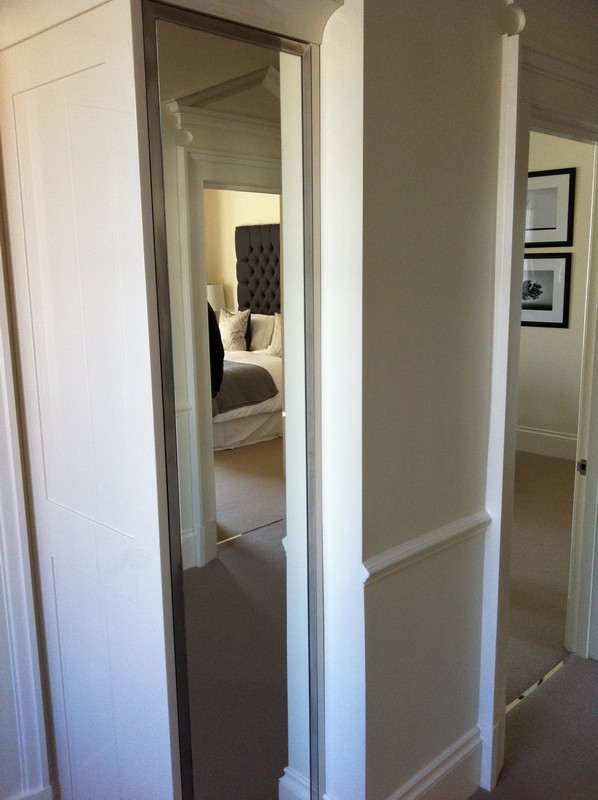 Full-length wardrobe mirror fitted in Muswell Hill home