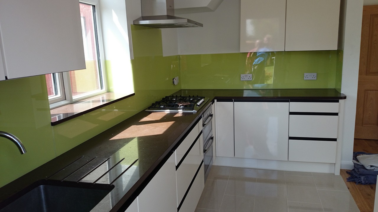 Lime green glass kitchen splashback installed by Muswell Hill glaziers