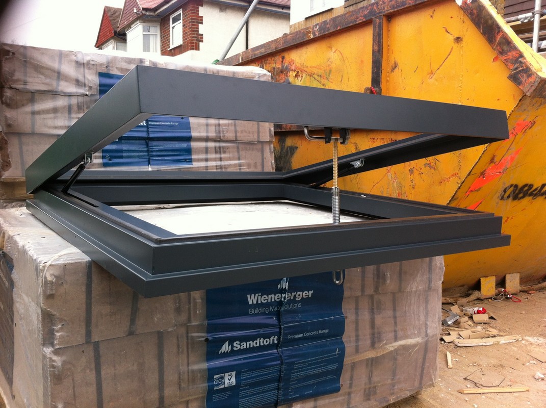 Opening flat roof skylight in anthracite grey installed in Muswell Hill