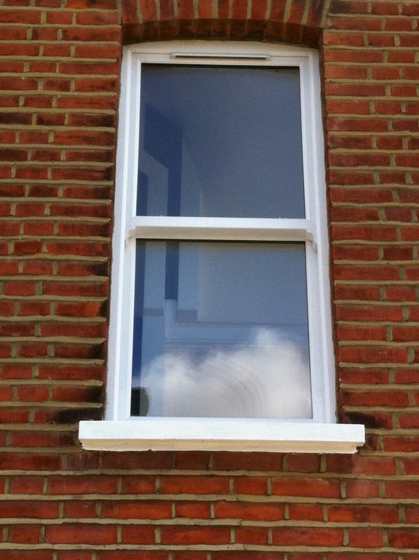 uPVC sash window on Victorian red brick house in Muswell Hill